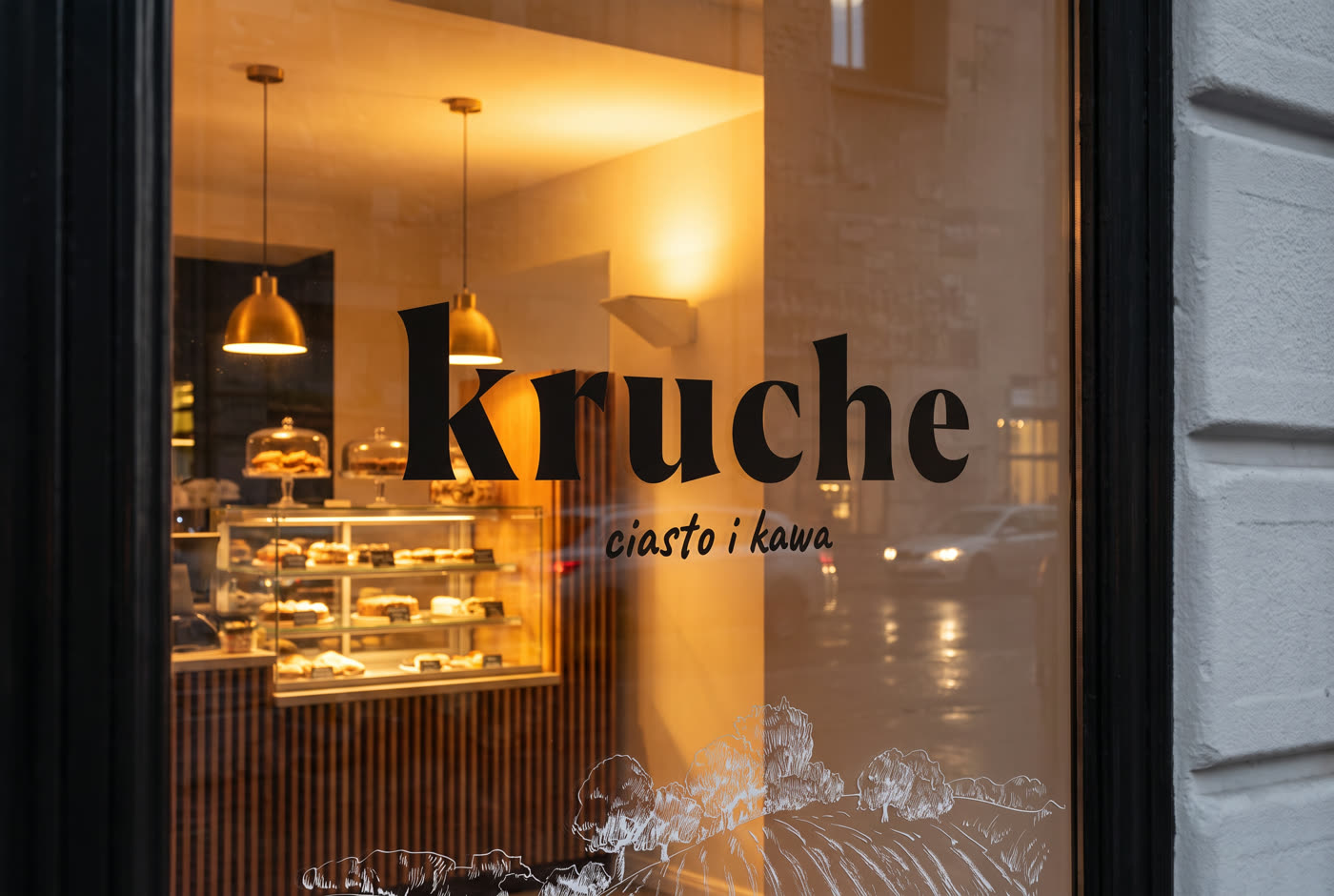 kruche - logo na witrynie lokalu wieczorem
